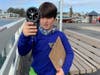 Solomon Coleman checked the wind speed and direction at the Santa Cruz Wharf Friday.