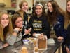 Students decorate a gingerbread house for Dublin High's annual competition.
