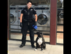 A Santa Cruz Police Department officer with the driver's dog.