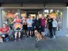 Runners meet outside Sunrise Mountain Sports.