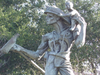 A firefighter carrying a baby near the San Ramon Valley Fire Protection District at 1500 Bollinger Canyon Road, by artist Peter Schifrin.