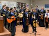 Mariachis practice and perform with help from local volunteers.