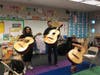 Mariachis practice and perform with help from local volunteers.