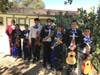 Mariachis practice and perform with help from local volunteers.