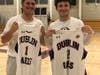 Stewy Thalblum, left, and brother Jon Thalblum swap jerseys.