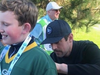 Aaron Rodgers signs Chase Miller's jersey.