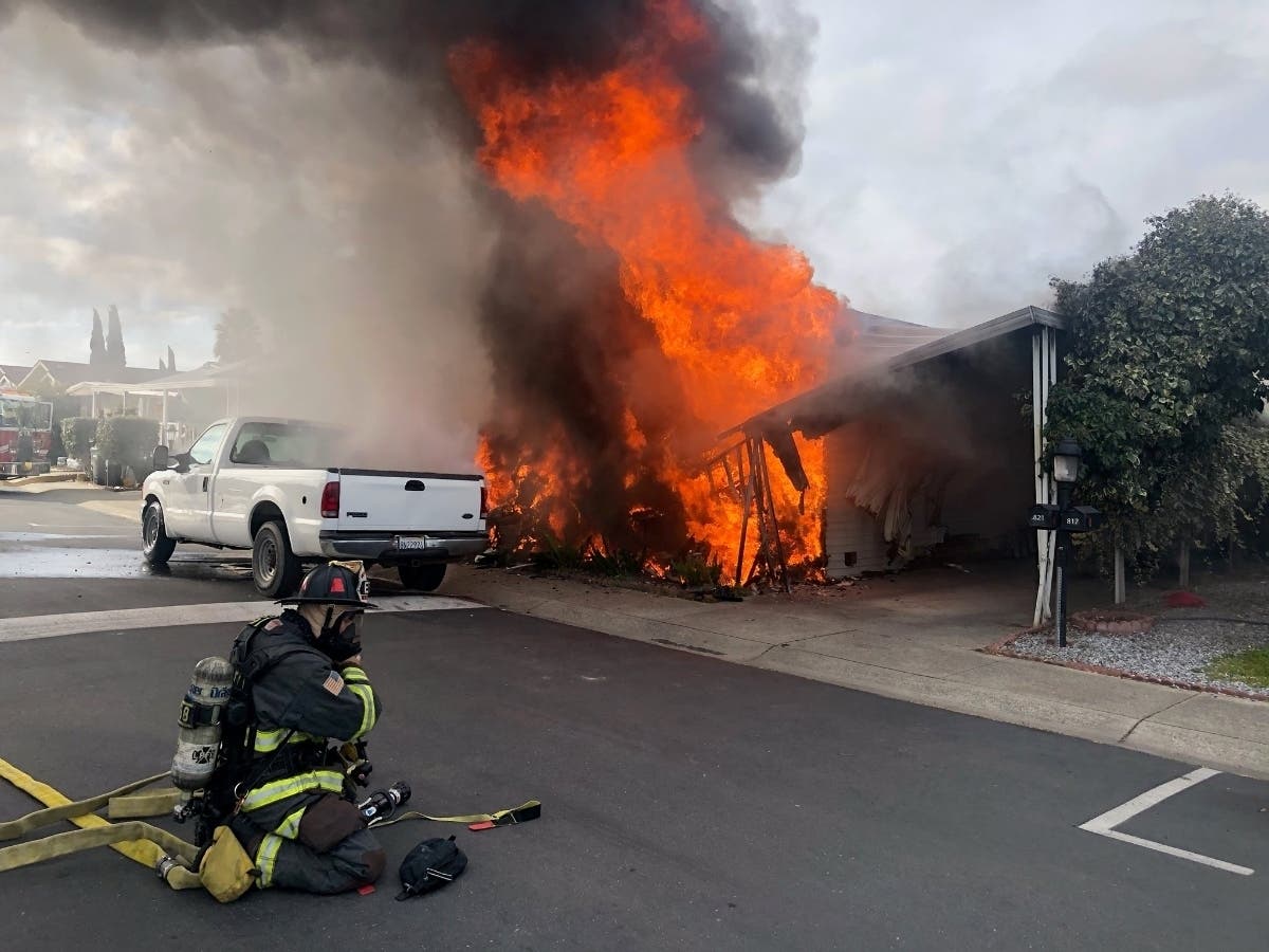 Firefighters stopped the blaze from spreading to two other homes, just 20 feet away.