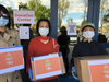 Tri-Valley Asian Association members ready boxes for health care providers.