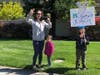 Donlon Elementary School families show appreciation for teachers participating in a parade.