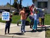 Donlon Elementary School families show appreciation for teachers participating in a parade.