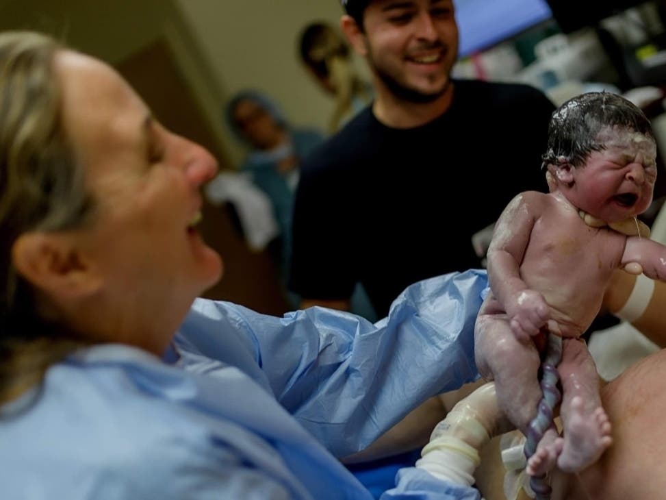 Casey Henshaw captures a happy delivery room scene featuring client Kayla Tostado's newborn.
