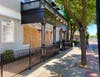 Downtown Danville businesses boarded up Monday.