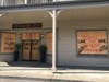 Pleasanton businesses boarded up their windows and left messages for the public.
