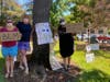Livermore residents Veronique Philibert (left), Paula Campbell (center) and Lashell Hudson were among the first to show at the Carnegie Park demonstration.