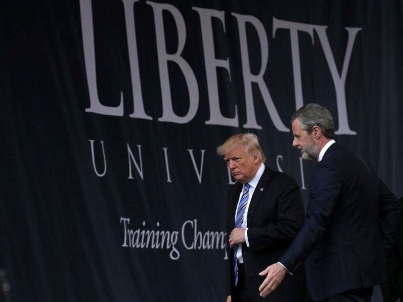 Liberty University President Jerry Falwell Jr., seen here with President Donald Trump, is welcoming back up to 5,000 students from spring break.