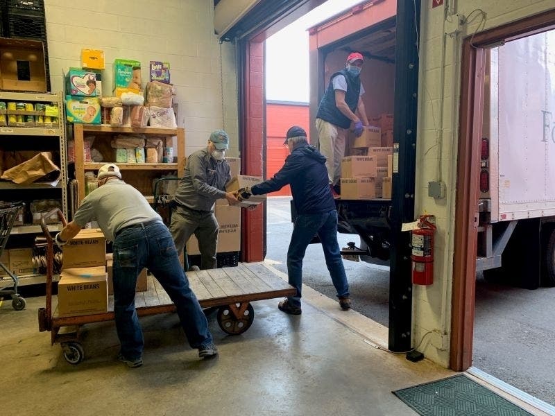 Volunteers with Western Fairfax Christian Ministries and Food for Others deliver food donated by members of the Church of Jesus Christ of Latter-day Saints.