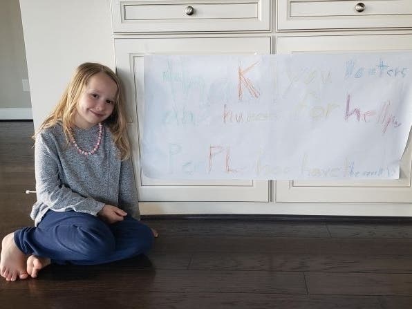 Kat Siedlecki's daughter Zosia launched a fundraising campaign for health care workers after making a sign expressing her gratitude.
