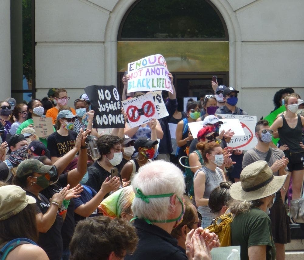 After marching from Columbia Pike to the government center in Courthouse Plaza, protesters called for an end to police killings of black people.
