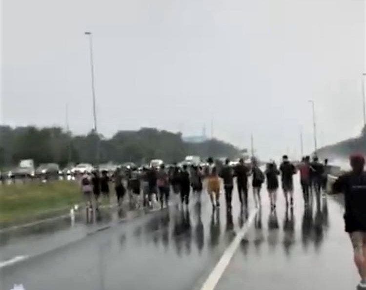 Dozens of people protesting the death of George Floyd marched in the HOV lanes of I-95 near Dumfries early Friday evening, blocking traffic.