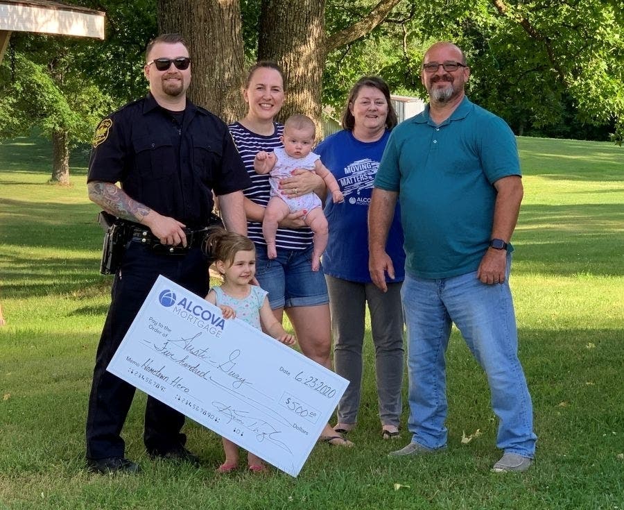 From left, Austin Guay, his wife Becky and children Lilly and Payton, ALCOVA Mortgage loan officer Kimberly Thagholm and friend Jeff Edmisten.