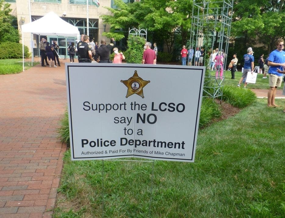 Supporters of Loudoun County Sheriff Mike Chapman rally Tuesday outside the Loudoun County Government Center.