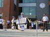 Bishop Michael F. Burbidge, Diocese of Arlington, conducts the official ribbon-cutting Thursday for St. Paul VI Catholic High School.