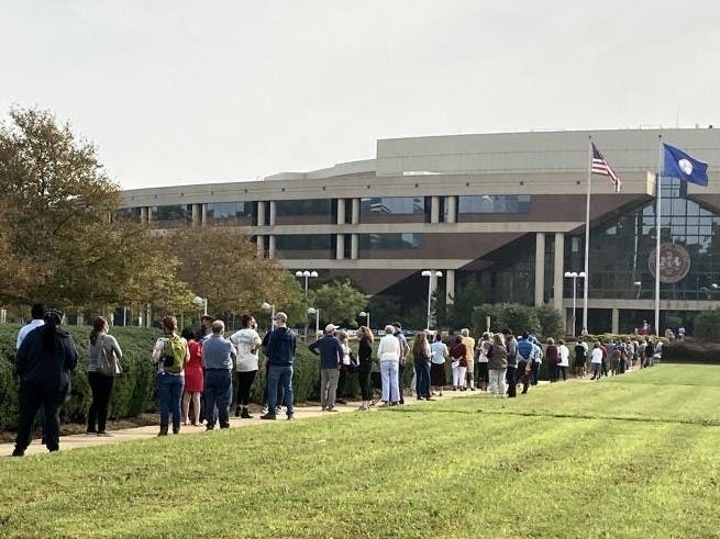 Hundreds of voters waited outside the Fairfax County Government Center Friday to cast their ballots on the first day of in-person absentee voting.