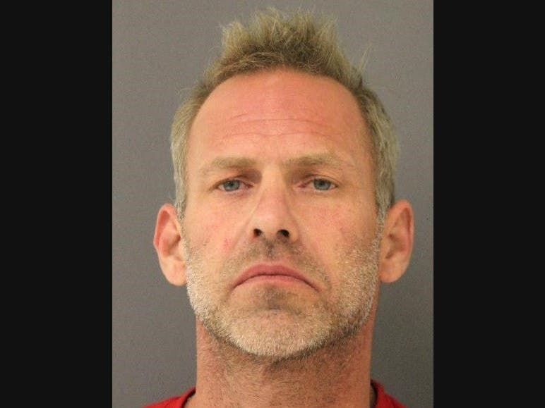 Joel Miller, 48, of Manassas, was arrested and ​charged with shooting within a dwelling, according to the Prince William County police.