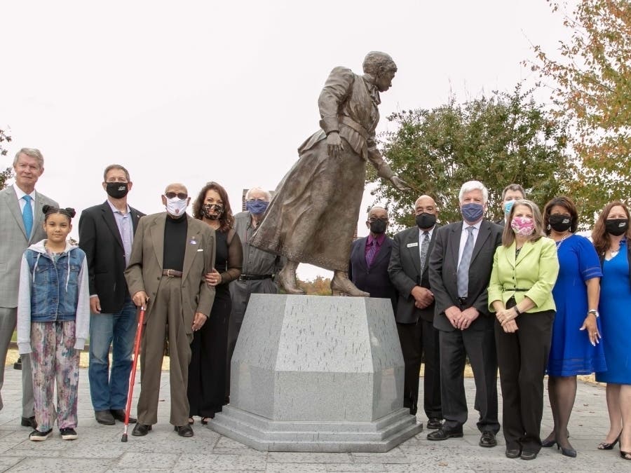 City of Manassas and state officials on Saturday unveiled a statue of school pioneer Jennie Dean, which will serve as the centerpiece of the Manassas Industrial School Memorial.