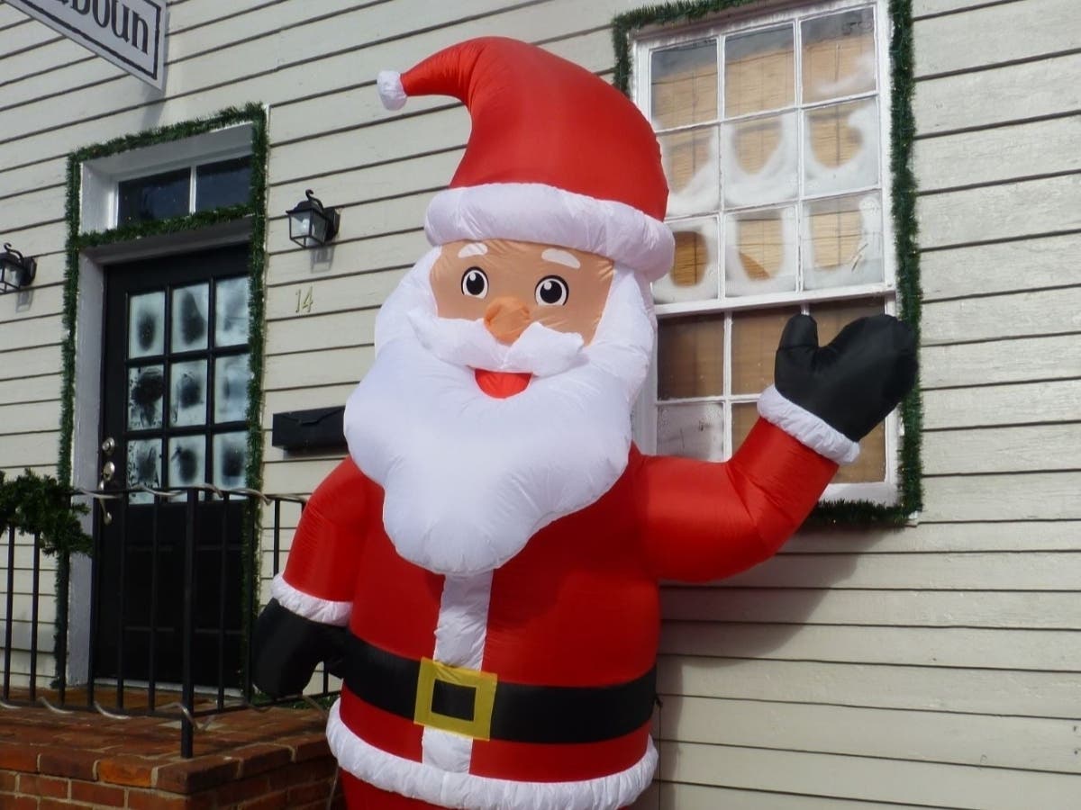 Santa waves at passers-by on Loudoun Street in downtown Leesburg to bring cheer to the holiday season.