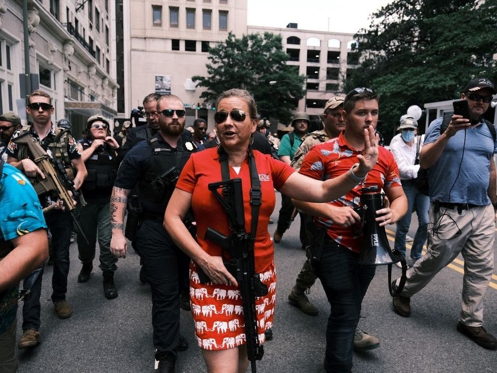 Virginia state Sen. Amanda Chase, seen here at an open carry protest on July 4, 2020, in Richmond, is currently the front-runner for the Republican nomination for governor.