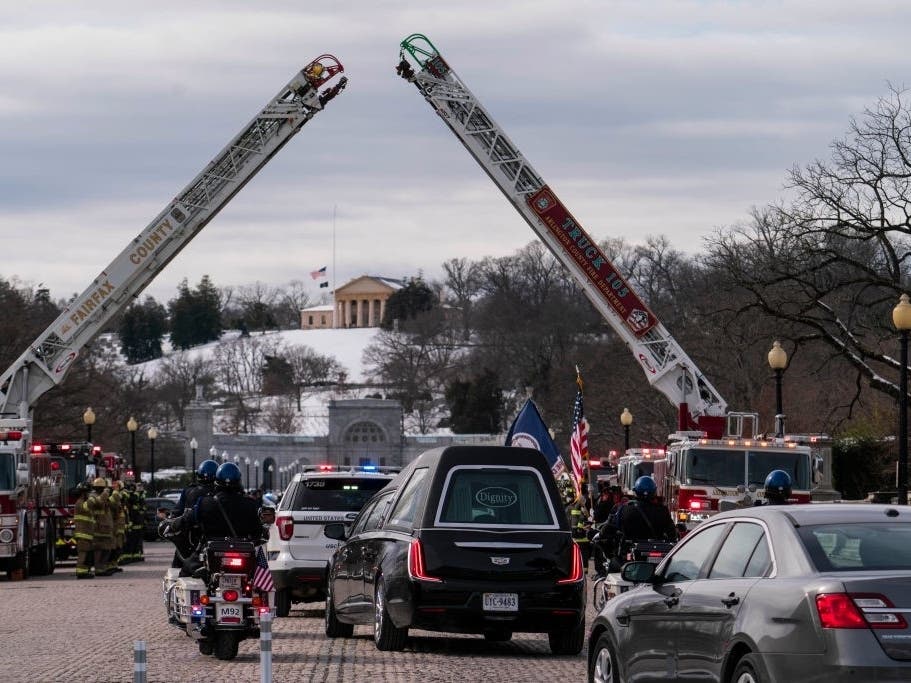 The funeral procession for U.S. Capitol Police Officer Brian Sicknick approaches Arlington National Cemetery on Feb. 3 in Arlington.