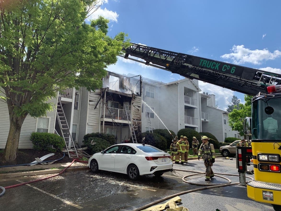 Firefighters work to put out a fire at the Chase Heritage Apartments in Sterling on April 30. The fire destroyed the apartments of 12 families.