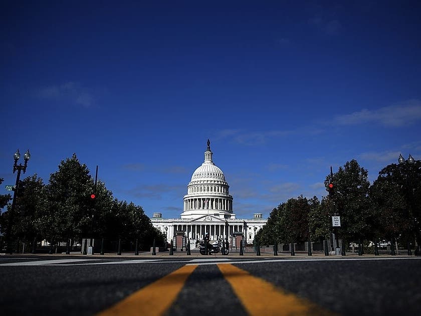 Two U.S. Capitol Police officers were traveling on their motorcycles near the Capitol when a white van attempted to cut across traffic toward a freeway on-ramp and struck one of the officers.