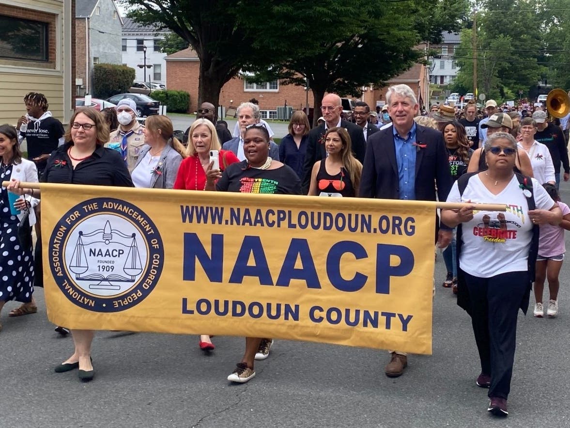 Loudoun County residents celebrate Juneteenth on Saturday, two days after it was declared a federal holiday, walking from the Loudoun County Courthouse in Leesburg to the Orion Anderson Lynching Memorial in Raflo Park.