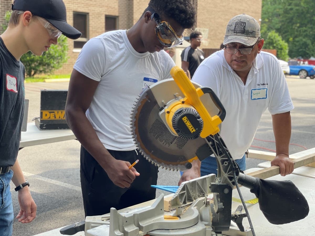 Participants in the Catholic Diocese of Arlington’s 2021 WorkCamp program conduct repairs on a home in Dale City. More than 600 teenagers in the diocese are volunteering their time in 2021 as part of the program.