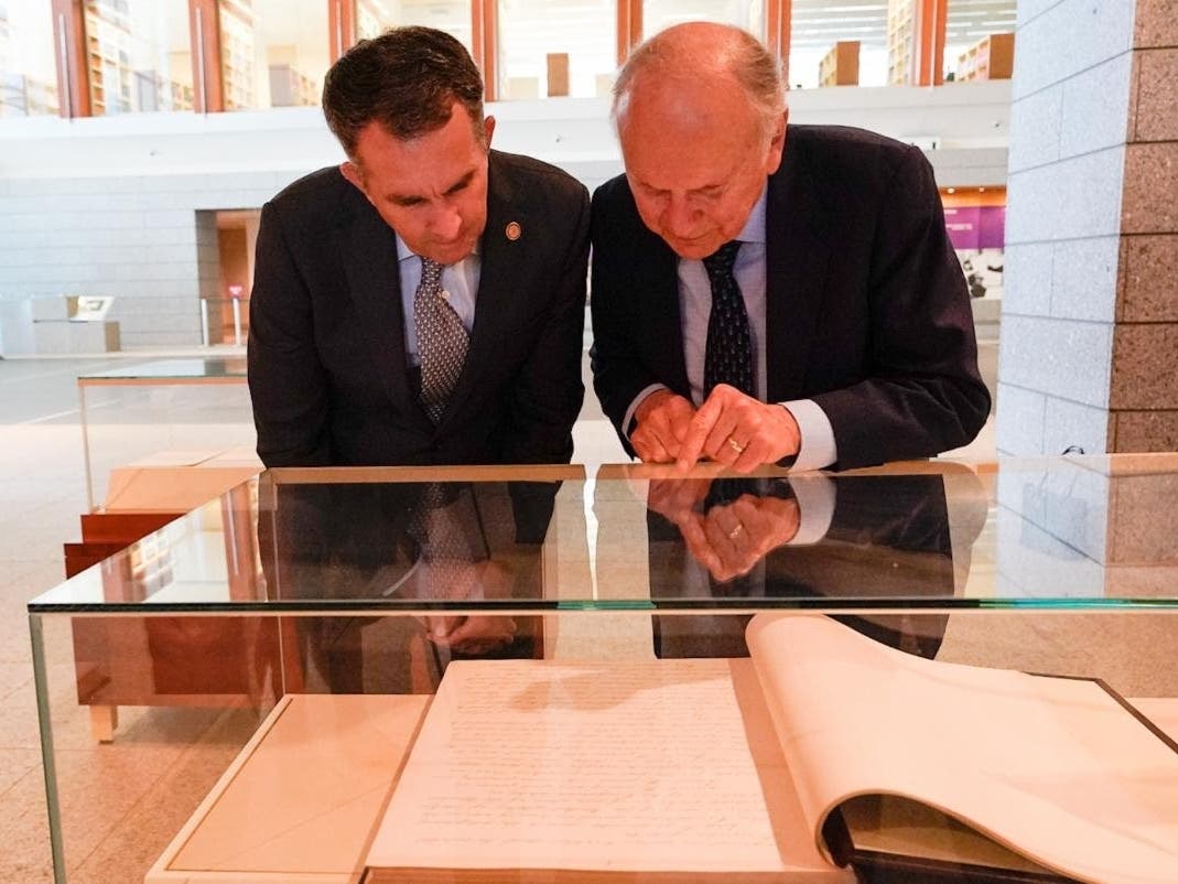 Virginia Gov. Ralph Northam and University of Virginia School of Law Professor A.E. Dick Howard view original copies of Virginia’s Constitutions at the Library of Virginia on Tuesday.