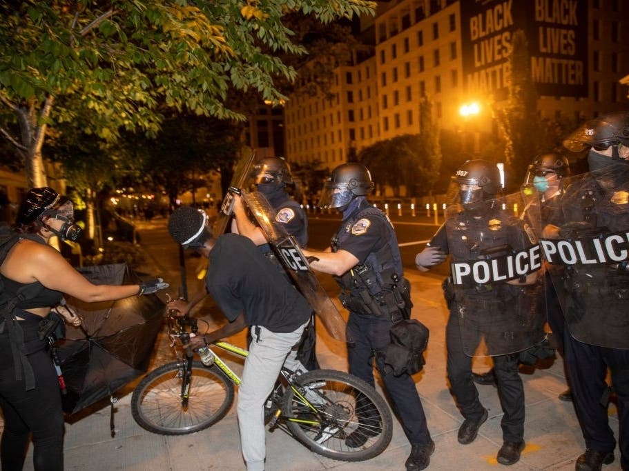 D.C. police officers deployed stun grenades and chemical irritants against a crowd of protesters around Black Lives Matter Plaza on Aug. 30, 2020.