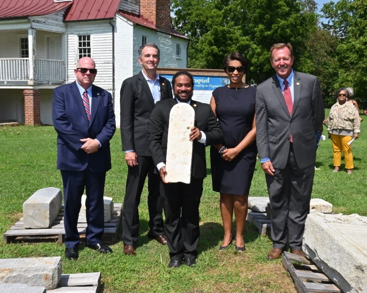 Maryland Gov. Larry Hogan, Gov. Ralph Northam, D.C. Mayor Muriel Bowser and other officials attend a ceremony Monday at Caledon State Park in King George, Virginia, to mark the official transfer of 55 historic African American headstones.