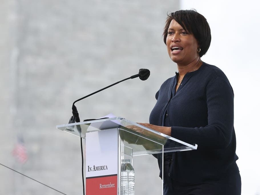 D.C. Mayor Muriel Bowser delivers remarks Friday during the opening ceremony of “In America: Remember,” a public art installation near the Washington Monument commemorating all the Americans who have died due to COVID-19.