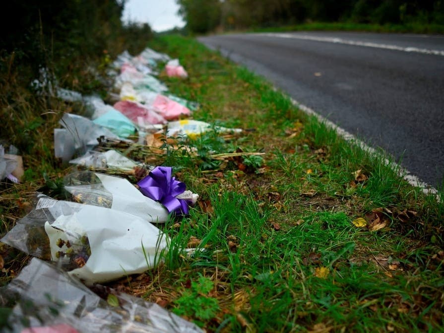 Flowers left in remembrance of Harry Dunn on a road near RAF Croughton in England where U.S. intelligence agency employee Anne Sacoolas of Virginia crashed into Dunn, who was driving his motorcycle on Aug. 27, 2019.