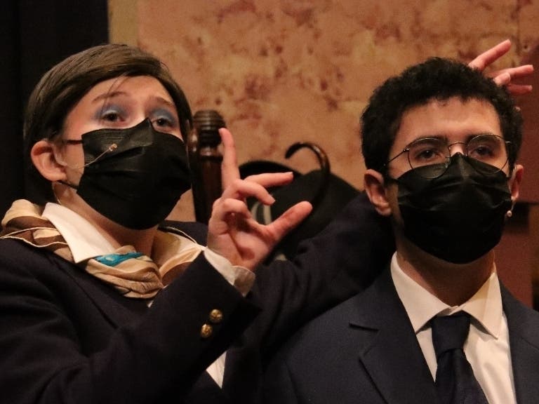 Valeria Peterson (left) as Mr. Paravicini and Daniel Azcarate as Detective Sergeant Trotter.