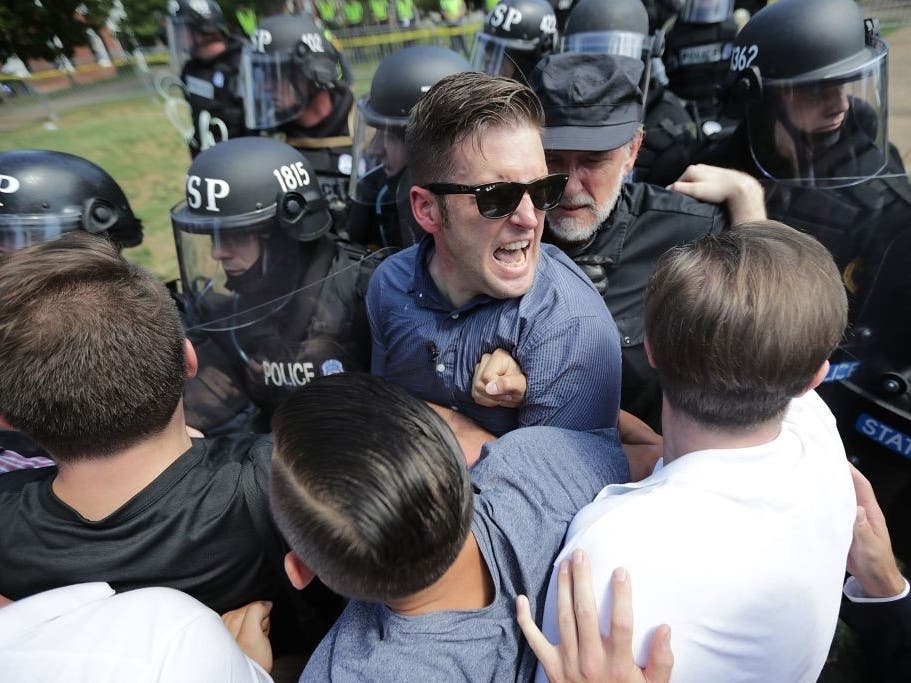 White nationalist Richard Spencer and his supporters clash with Virginia State Police after the Unite the Right rally was declared an unlawful gathering Aug. 12, 2017 in Charlottesville.