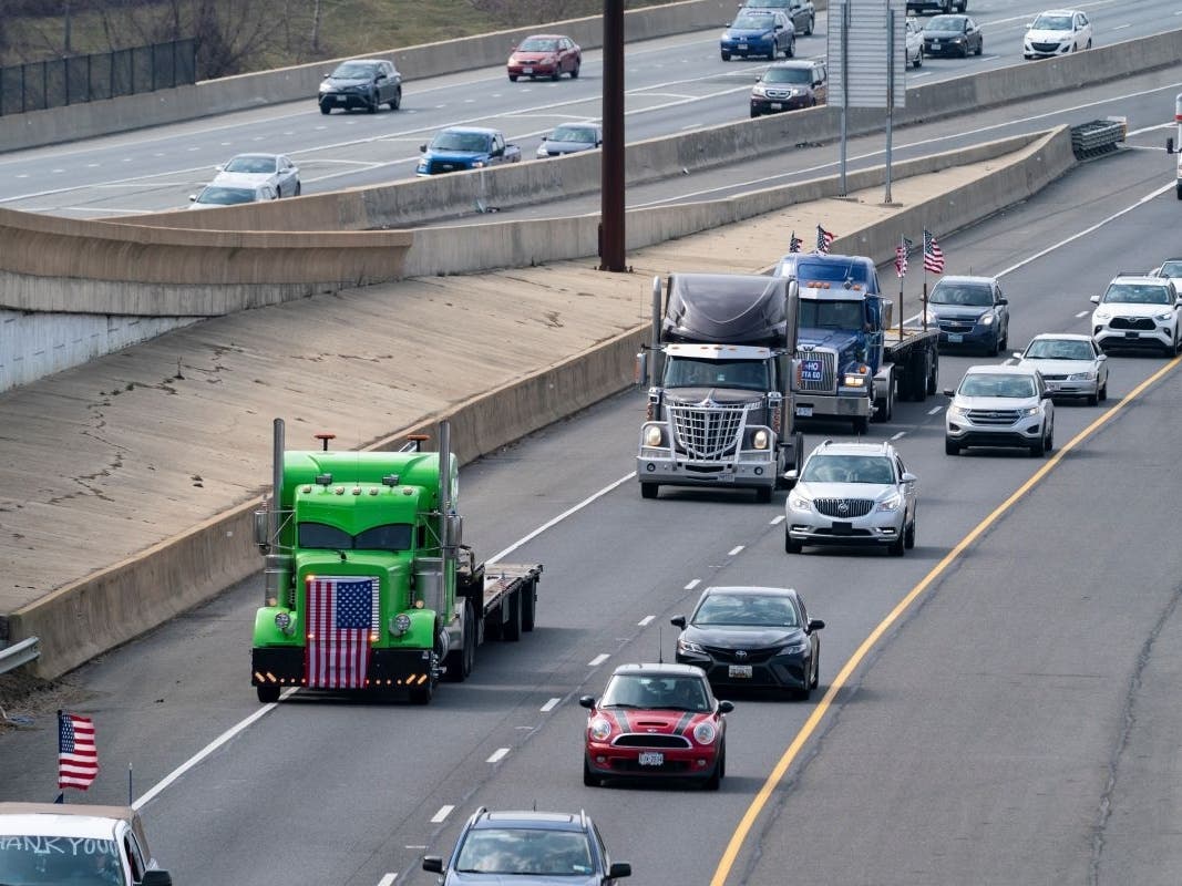 A trucker convoy that had been circling the Capital Beltway to protest COVID-19 mandates crossed from Virginia into the District of Columbia Monday afternoon to begin a second week of protests.
