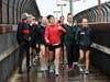 Meridian High School students join Kate Fletcher, a 1992 graduate of George Mason High School, as she crosses W. Broad Street on the W&OD Trail bridge in Falls Church as part of her 105-run from Louisa County to Washington, D.C.