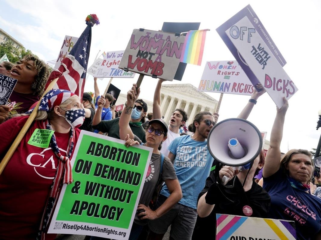 People protest about abortion on Friday outside the Supreme Court in Washington. The Supreme Court ended constitutional protections for abortion that had been in place nearly 50 years.