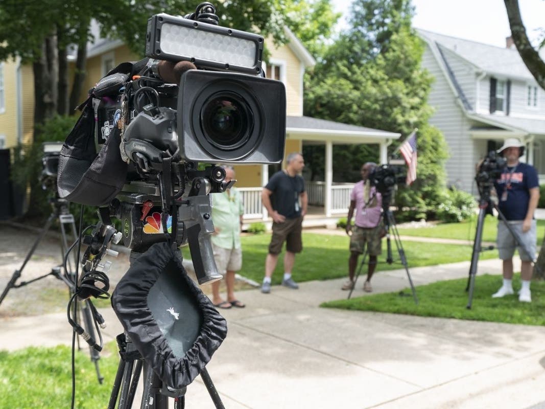 Television crews film near the home of Supreme Court Justice Brett Kavanaugh, in Chevy Chase, Maryland, on June 8. Protesters outside the homes of Kavanaugh and Chief Justice John Roberts have raised security concerns and political bickering.