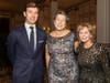 Left to right: Auctioneer, Tom Best, REACH – Executive Director, Laura Van Zandt, & Emcee, Robin Young, WBUR – Radio.