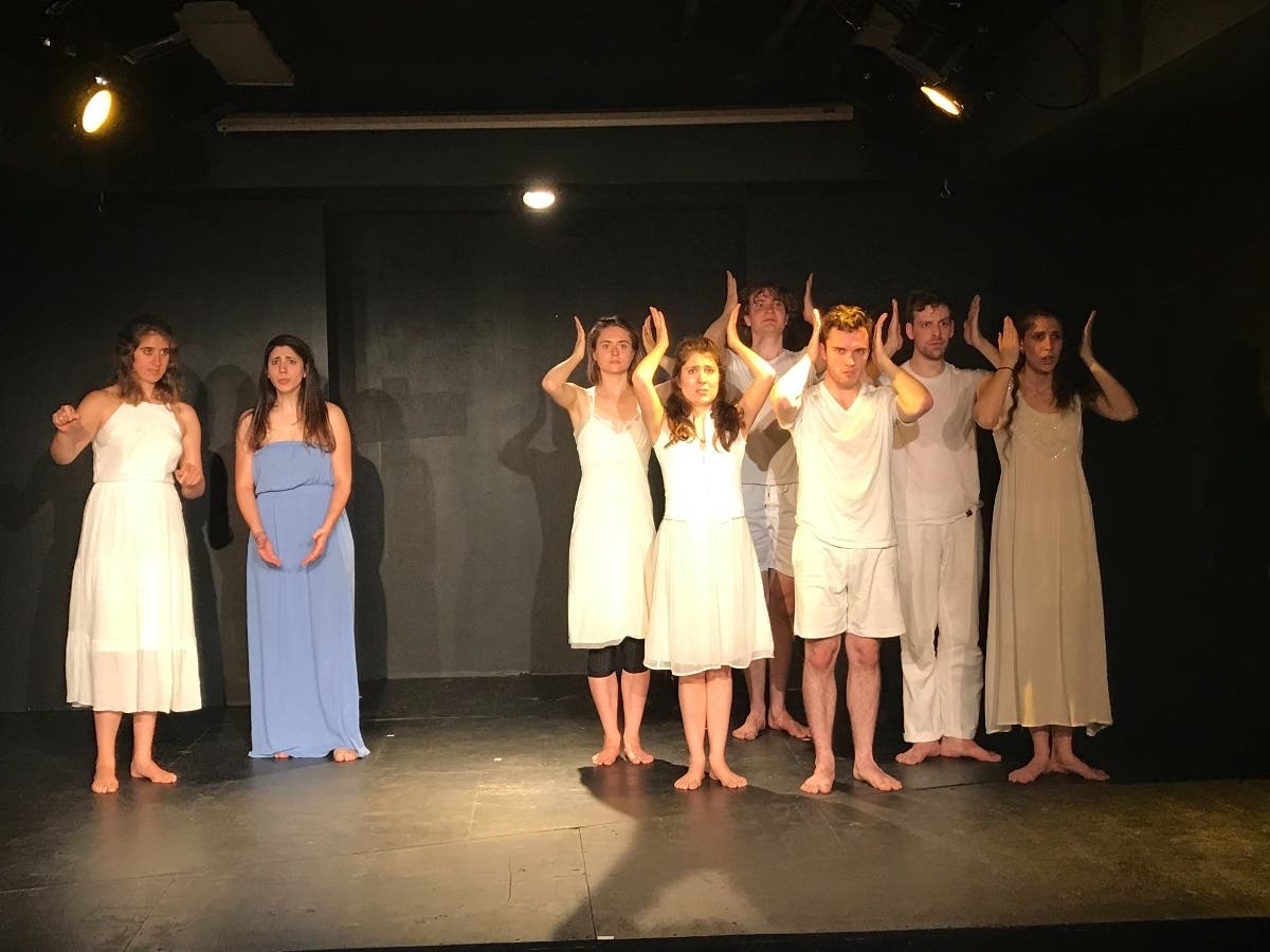 a scene from Golden Girl By The Sea (L-R Sarah Bitar, Chrysi Syalidi, Ella Rivers, Emma Harvey, Josh Davis, Vincent Van der Velde, Annasole Podesta)
