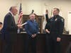 Mike Dzierzega is sworn in by Village President Tom Cauley at Tuesday's Village Board meeting. 